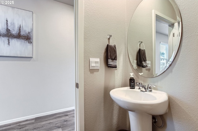 7897 SW Mara Ct, Portland, OR 97224 - bathroom with wood finished floors and baseboards