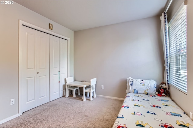 7897 SW Mara Ct, Portland, OR 97224 - carpeted bedroom featuring a closet and baseboards