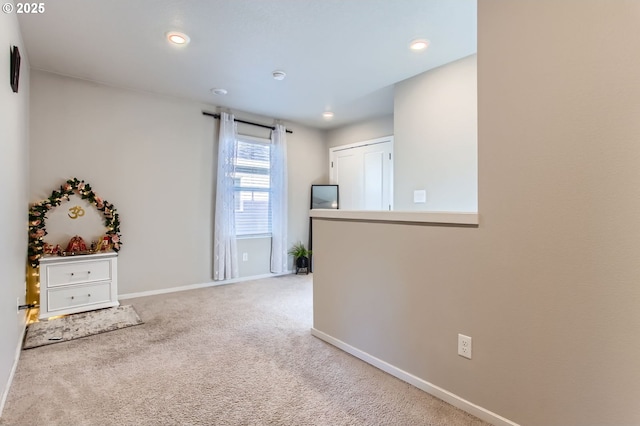 7897 SW Mara Ct, Portland, OR 97224 - unfurnished living room featuring carpet floors, baseboards, and recessed lighting