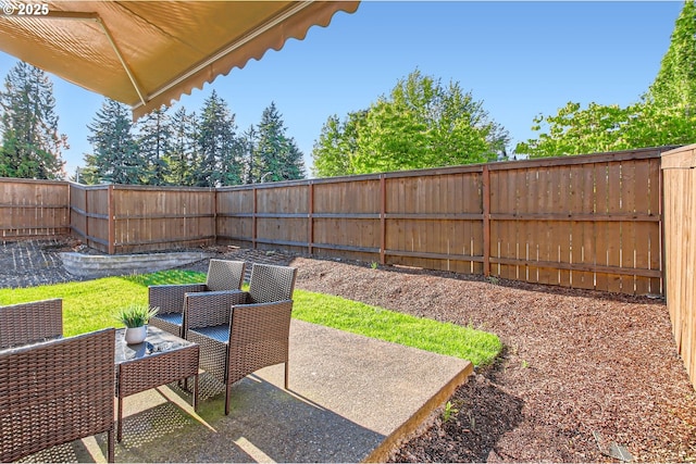 7897 SW Mara Ct, Portland, OR 97224 - fenced backyard featuring a patio