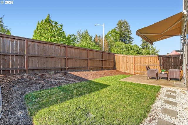 7897 SW Mara Ct, Portland, OR 97224 - view of yard featuring a patio area