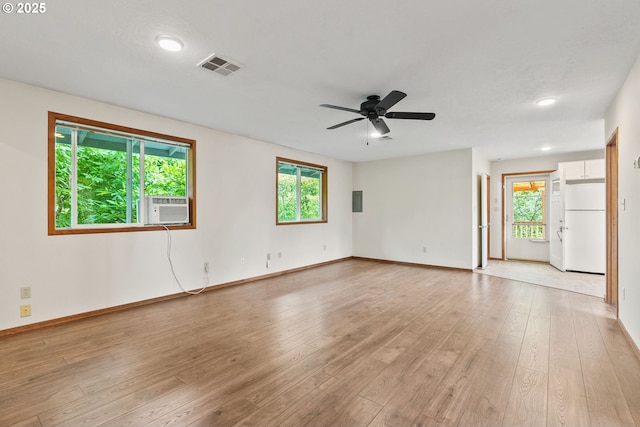 380 W Arlington St, Gladstone, OR 97027 - spare room with healthy amount of natural light, light wood-style flooring, ceiling fan, recessed lighting, and cooling unit