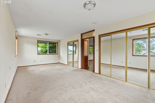 380 W Arlington St, Gladstone, OR 97027 - unfurnished bedroom with multiple closets and carpet