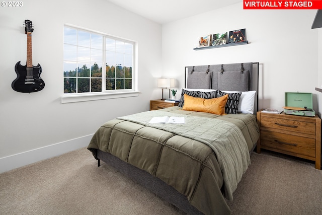 carpeted bedroom with baseboards