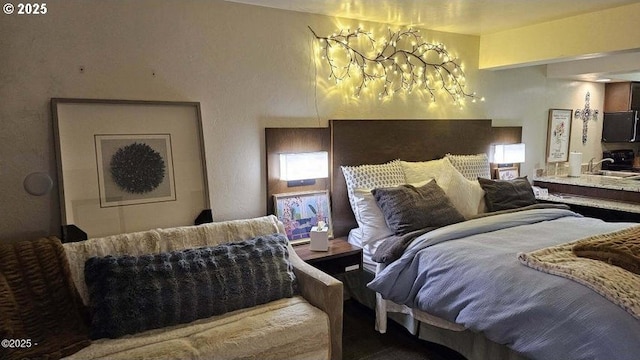 bedroom featuring a chandelier and a sink