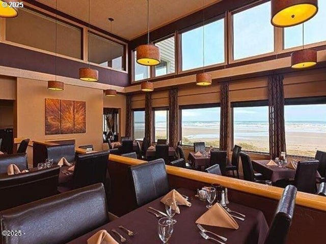 interior space with view of water and beach