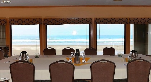 dining area featuring a water view