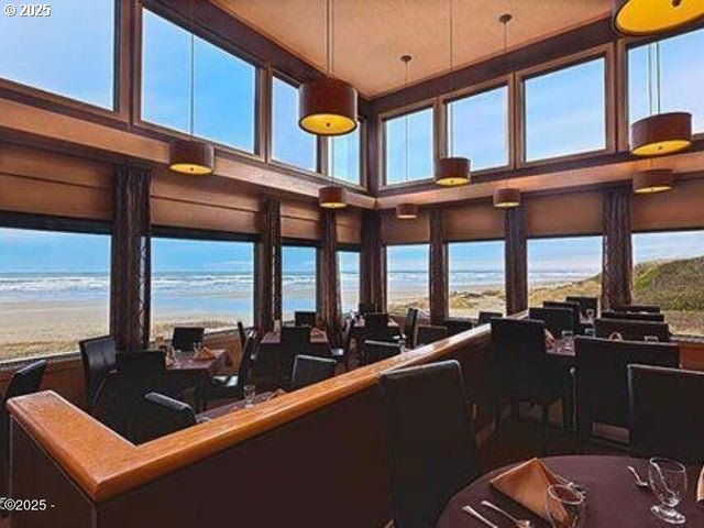 88416 1st Ave Unit 402, Florence, OR 97439 - sunroom with a water view and plenty of natural light