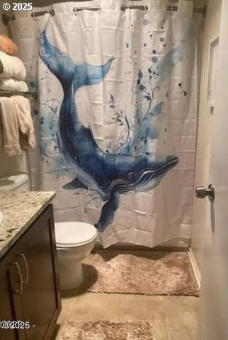 full bathroom with vanity, a shower with curtain, toilet, and tile patterned flooring