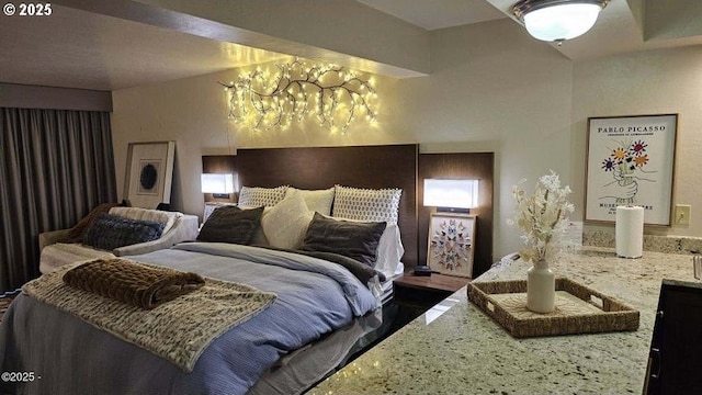 bedroom with a chandelier