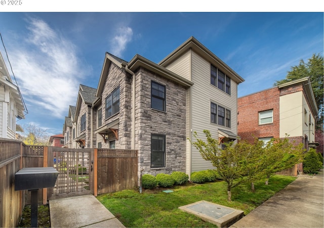 621 NE Randall Ave, Portland, OR 97232 - view of side of home with stone siding and a gate