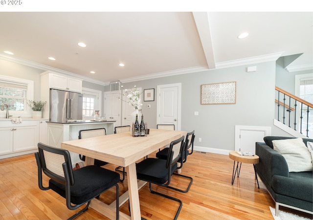 621 NE Randall Ave, Portland, OR 97232 - dining room with ornamental molding, light wood-style floors, stairway, recessed lighting, and baseboards