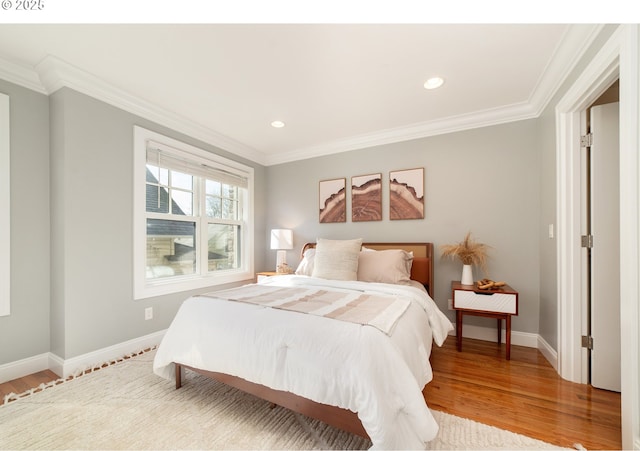 621 NE Randall Ave, Portland, OR 97232 - bedroom with ornamental molding, light wood-style flooring, baseboards, and recessed lighting
