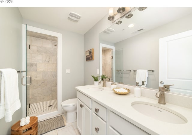 621 NE Randall Ave, Portland, OR 97232 - bathroom with a stall shower, toilet, double vanity, and tile patterned floors