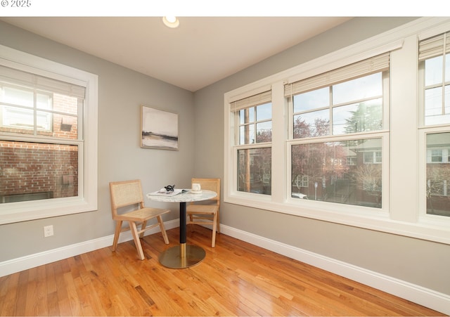 621 NE Randall Ave, Portland, OR 97232 - dining area with baseboards, light wood finished floors, and healthy amount of natural light