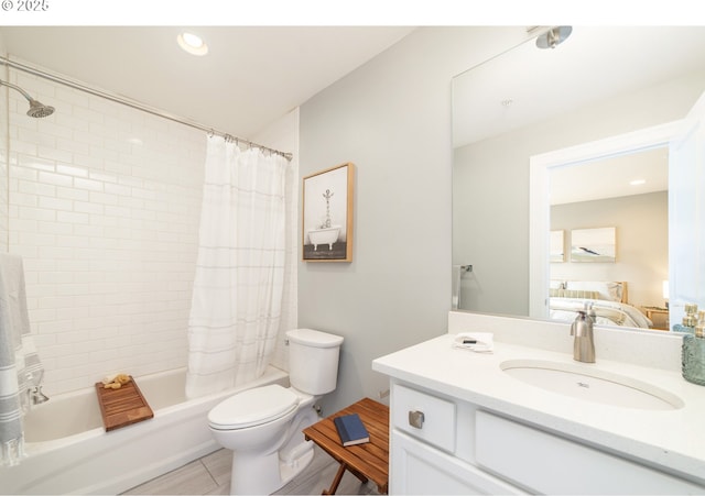 621 NE Randall Ave, Portland, OR 97232 - bathroom featuring toilet, vanity, shower / bath combo with shower curtain, recessed lighting, and tile patterned floors