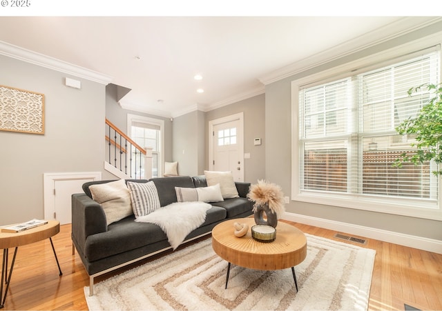 621 NE Randall Ave, Portland, OR 97232 - living area with stairs, light wood-style flooring, ornamental molding, recessed lighting, and baseboards