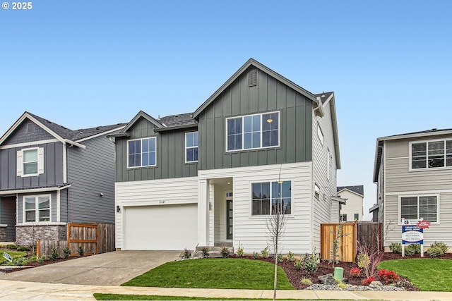 craftsman-style home featuring a front lawn and a garage