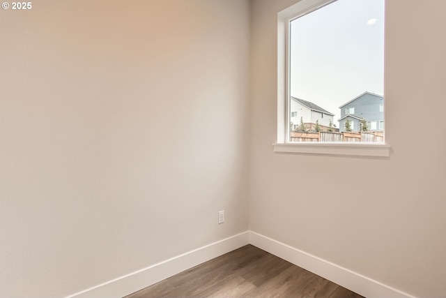 spare room with wood-type flooring