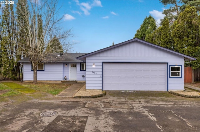 ranch-style home with a garage