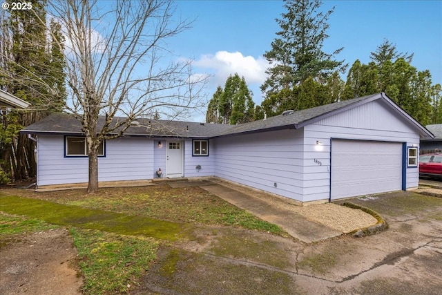 ranch-style home featuring an attached garage