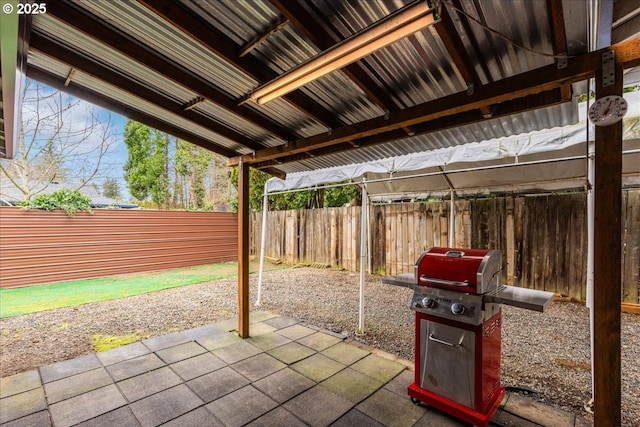 view of patio featuring area for grilling and fence private yard