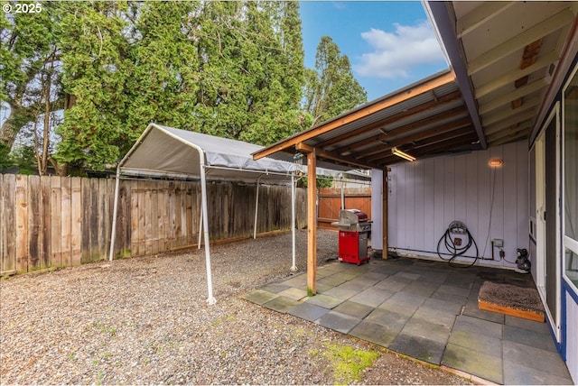 view of patio with a fenced backyard and area for grilling