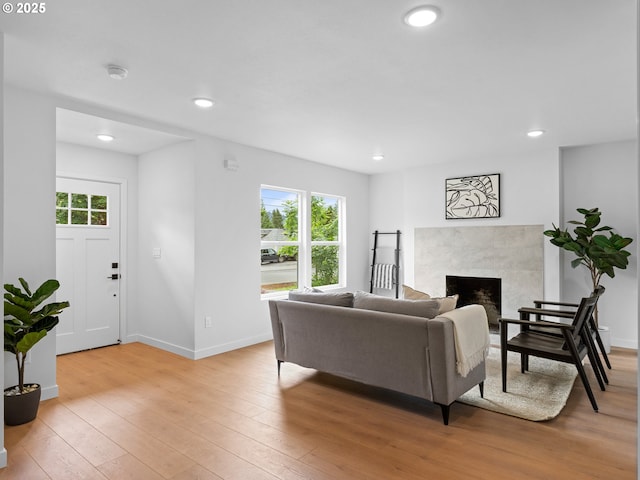 3401 SE 129th Ave, Portland, OR 97236 - living room featuring healthy amount of natural light, light wood-style flooring, a high end fireplace, and recessed lighting