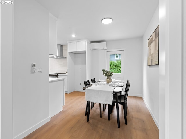 3401 SE 129th Ave, Portland, OR 97236 - dining space featuring an AC wall unit and light wood-style flooring