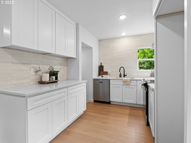 3401 SE 129th Ave, Portland, OR 97236 - kitchen with dishwasher, range with electric stovetop, decorative backsplash, white cabinetry, and recessed lighting