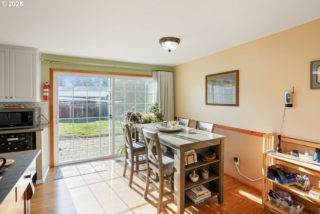 dining room featuring light hardwood / wood-style floors