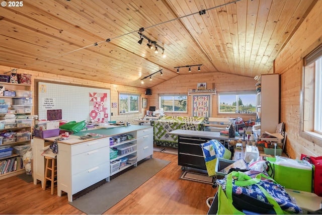 kitchen featuring vaulted ceiling, wooden ceiling, white cabinetry, and plenty of natural light