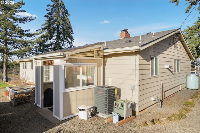 back of property with central AC unit