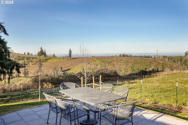 view of patio / terrace featuring a rural view