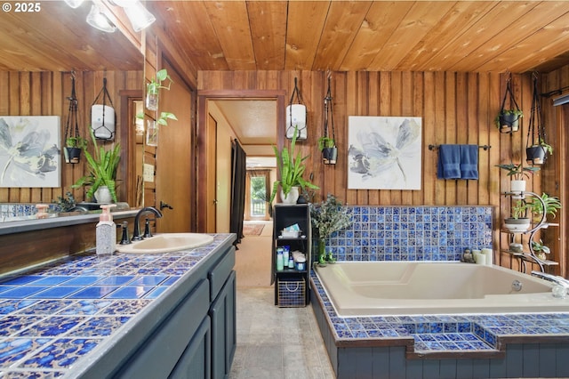 33712 Rainbows End Ln, Warrenton, OR 97146 - bathroom with wood walls, wooden ceiling, vanity, and a garden tub