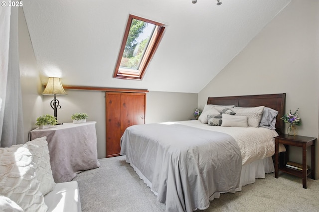 33712 Rainbows End Ln, Warrenton, OR 97146 - bedroom with light colored carpet, vaulted ceiling, and a skylight
