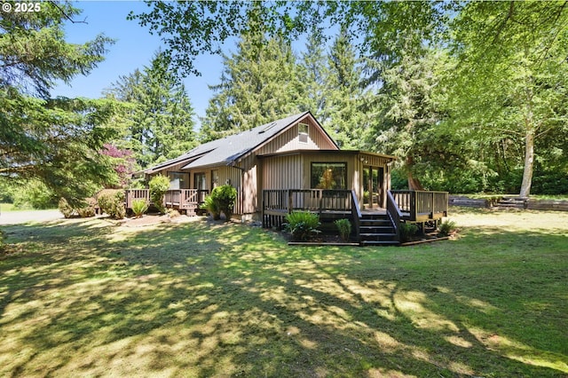 33712 Rainbows End Ln, Warrenton, OR 97146 - view of front of property featuring a wooden deck and a front lawn
