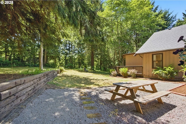 33712 Rainbows End Ln, Warrenton, OR 97146 - view of green lawn with a deck and a patio