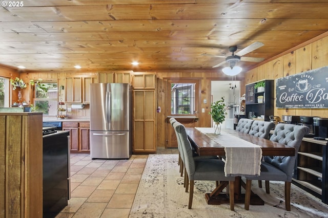 33712 Rainbows End Ln, Warrenton, OR 97146 - dining space with wooden ceiling, wood walls, and a ceiling fan