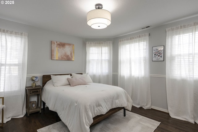 bedroom featuring wood finished floors
