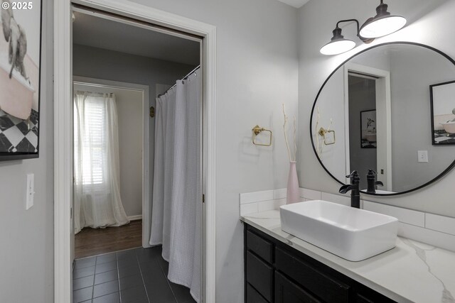 bathroom with tile patterned floors and vanity