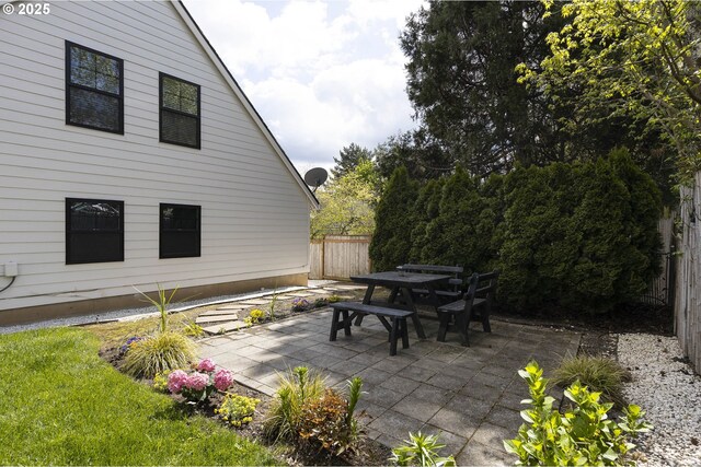 view of patio / terrace with outdoor dining space and fence