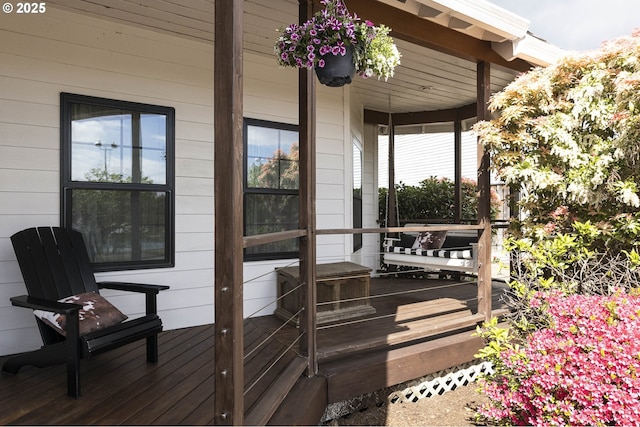 wooden terrace featuring covered porch