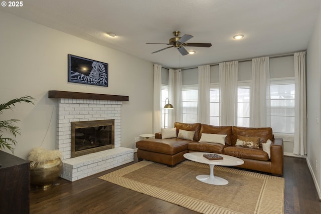 living area featuring a ceiling fan, dark wood-style flooring, a fireplace, and recessed lighting