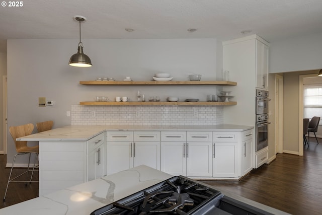 kitchen with white cabinets, backsplash, open shelves, and dark wood-style flooring