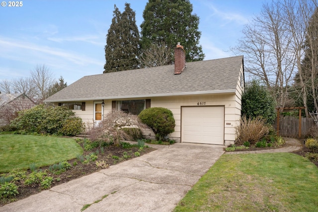 view of front of home with roof with shingles, a chimney, concrete driveway, a front lawn, and a garage