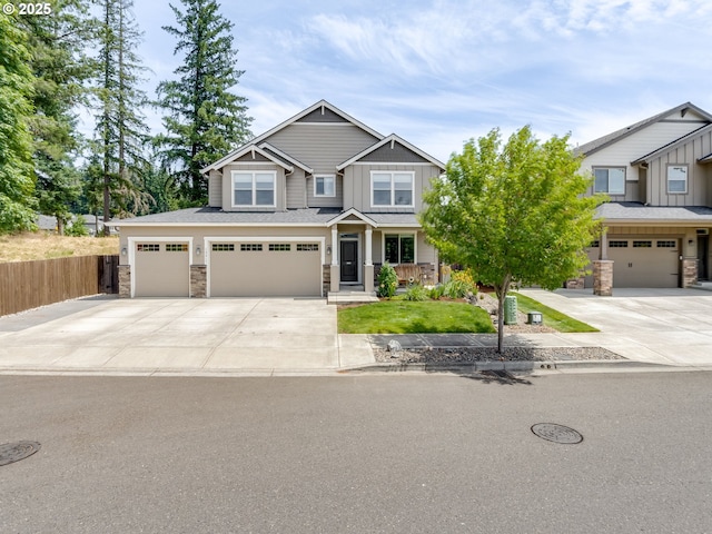 13317 NE 60th Ave, Vancouver, WA 98686 - craftsman-style house with stone siding, board and batten siding, concrete driveway, and an attached garage