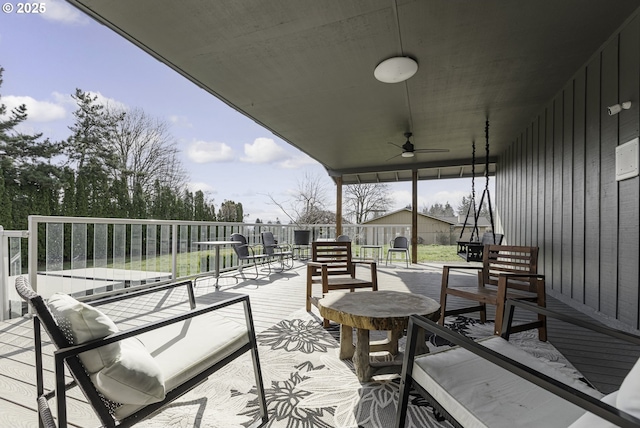 deck featuring an outdoor hangout area and a ceiling fan