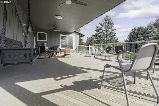 view of patio featuring an outdoor hangout area, a wooden deck, and ceiling fan