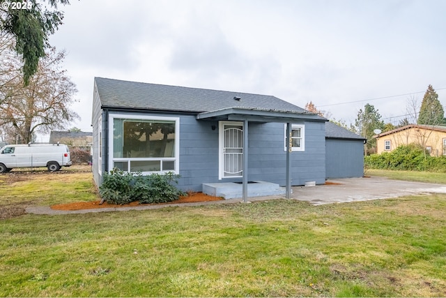 bungalow-style home featuring a front yard